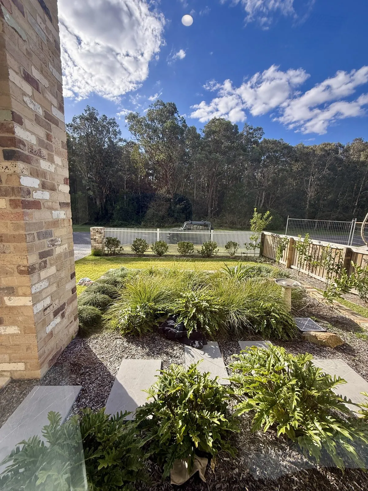 Native garden at the front of Drift, Tea Gardens with stone pavers