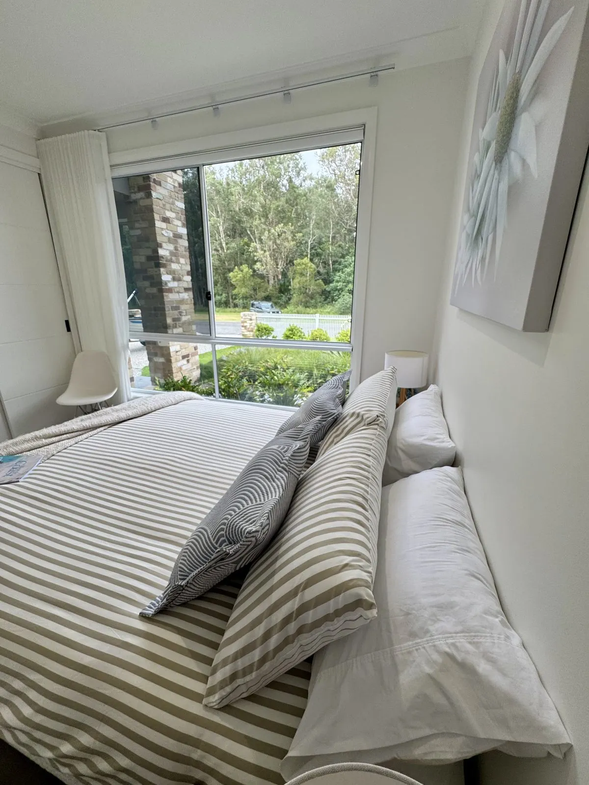 Queen bedroom with garden views at Drift, Tea Gardens