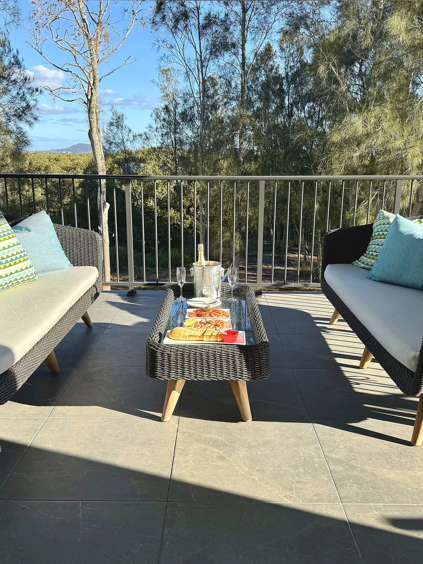 The River Balcony — outdoor lounge overlooking the bush and Myall River at Drift, Tea Gardens