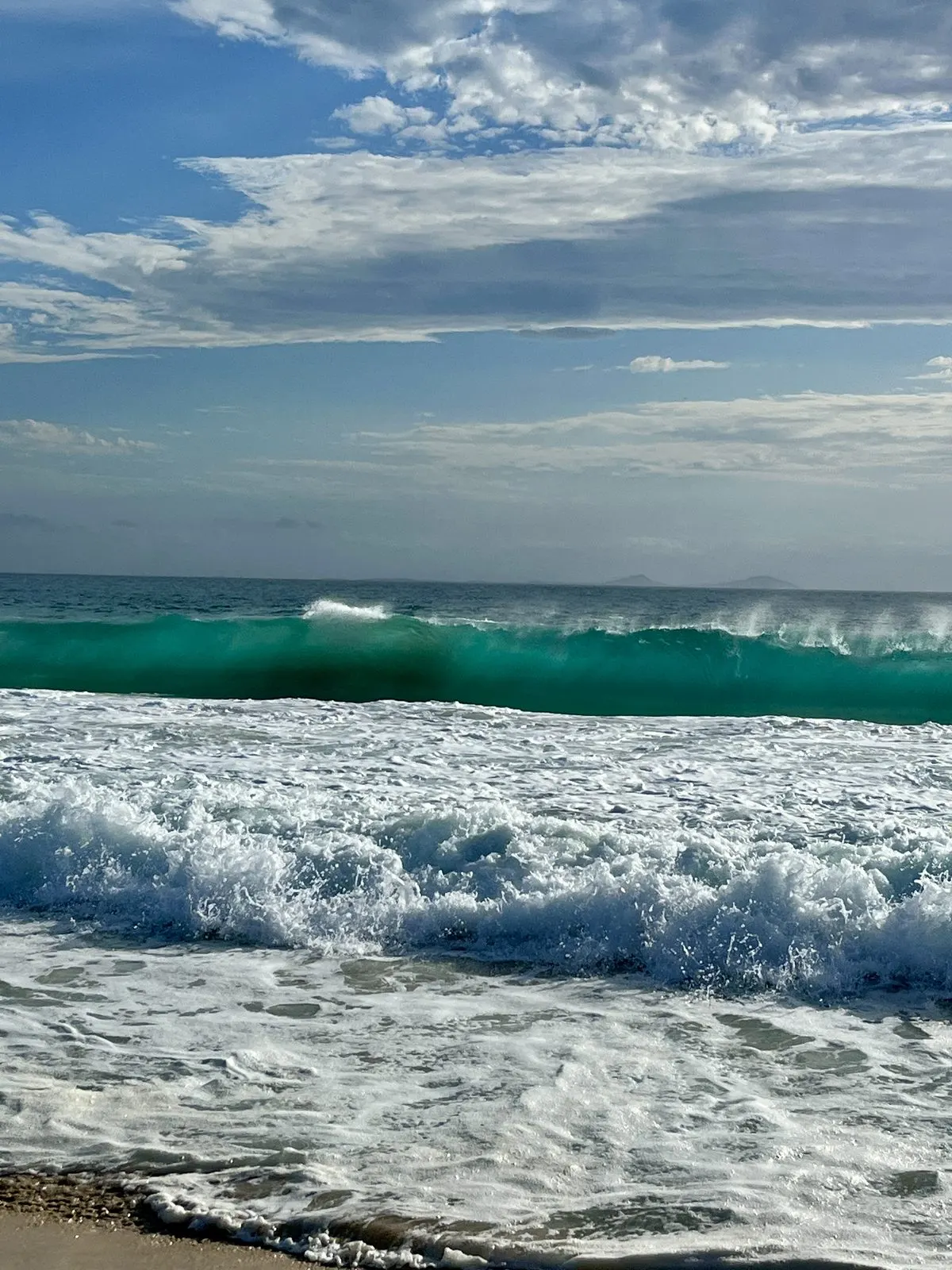 Turquoise surf breaking at Bennetts Beach, Port Stephens NSW