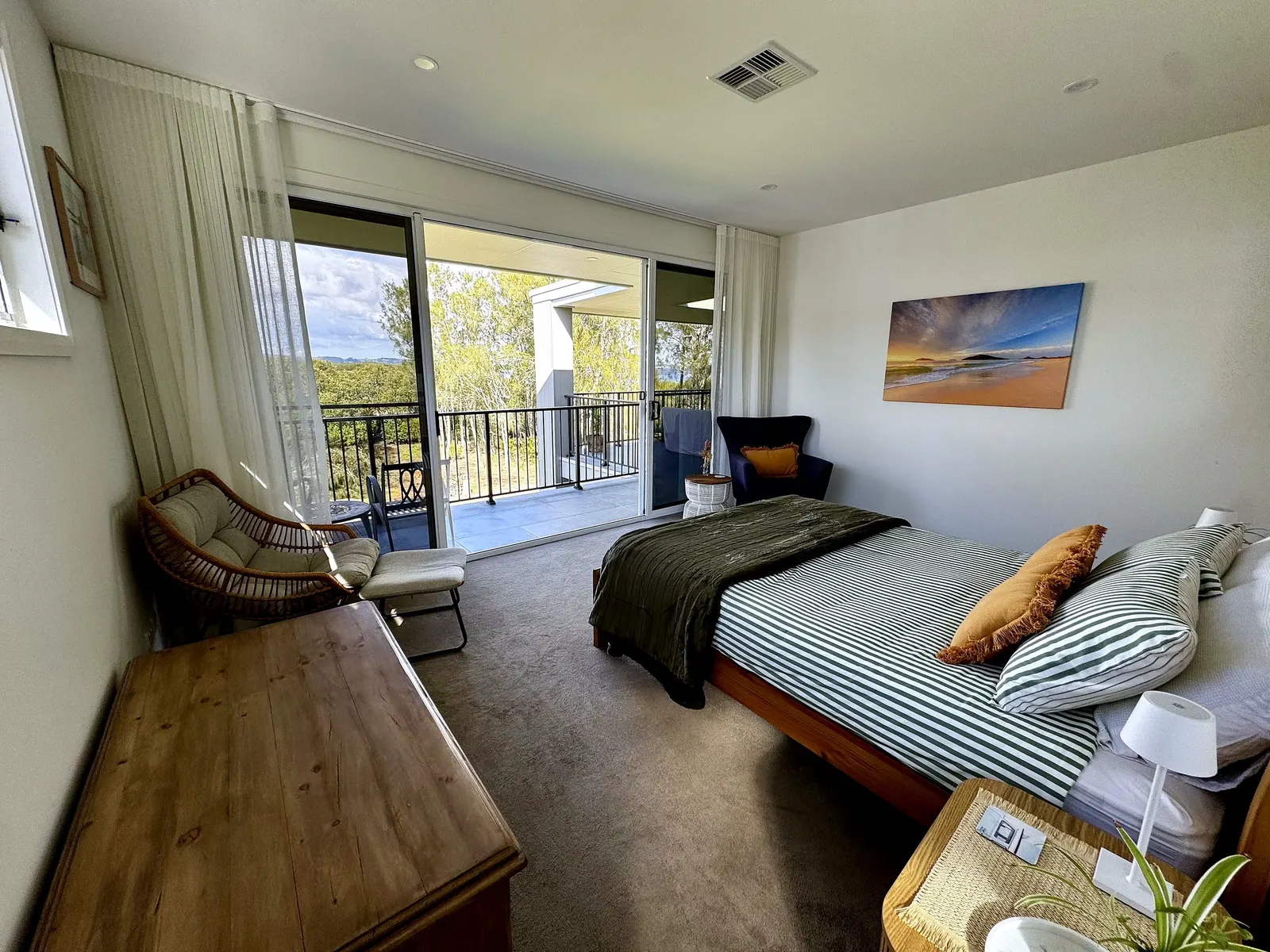 Master bedroom with private balcony and bush outlook at Drift, Tea Gardens