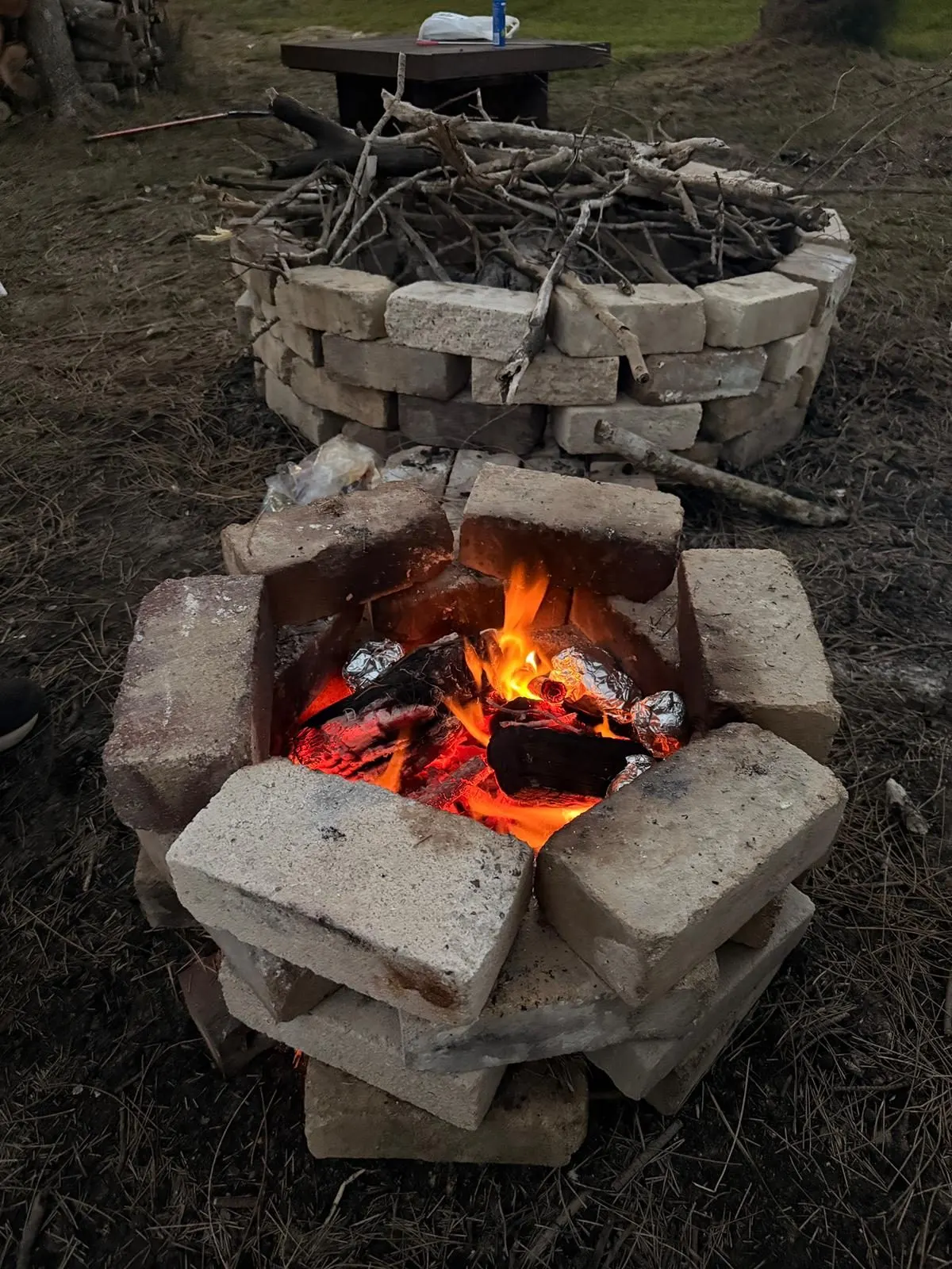 Dual fire pits on the riverbank near Drift, Tea Gardens