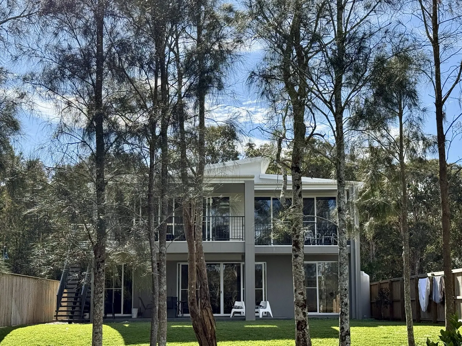 Rear of Drift holiday house viewed from the garden, showing both decks