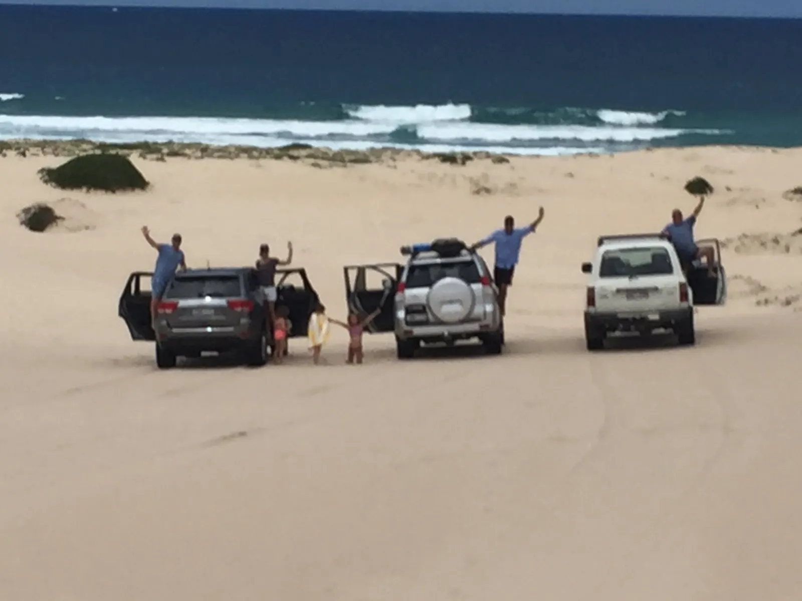 Friends with their 4WDs on the beach near Hawks Nest